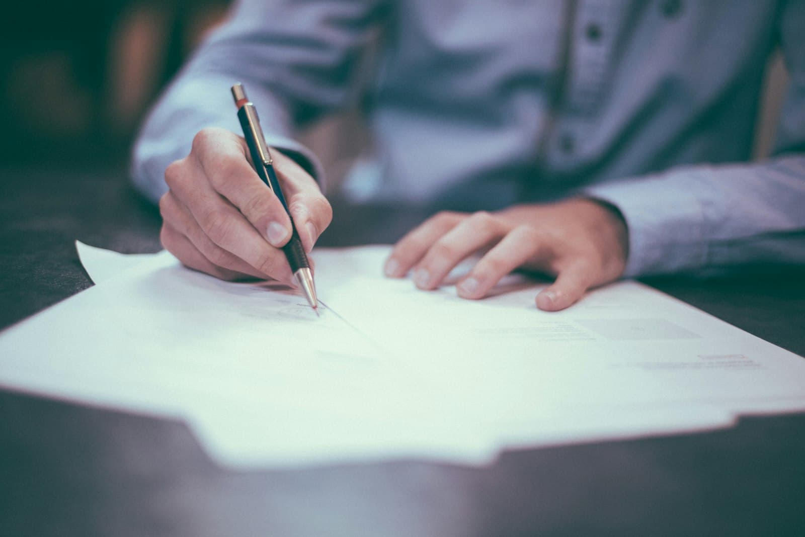A purchase agreement being signed