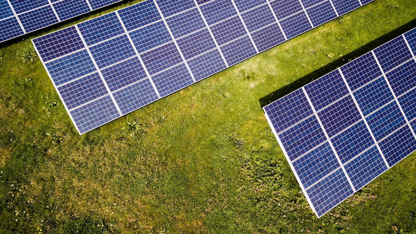 Aerial view of solar panels installed on open ground