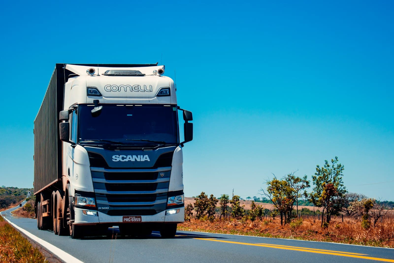 A haulage truck on the road carrying a delivery