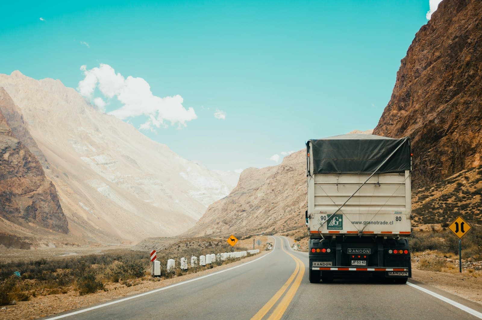 A cargo truck travelling a highway route