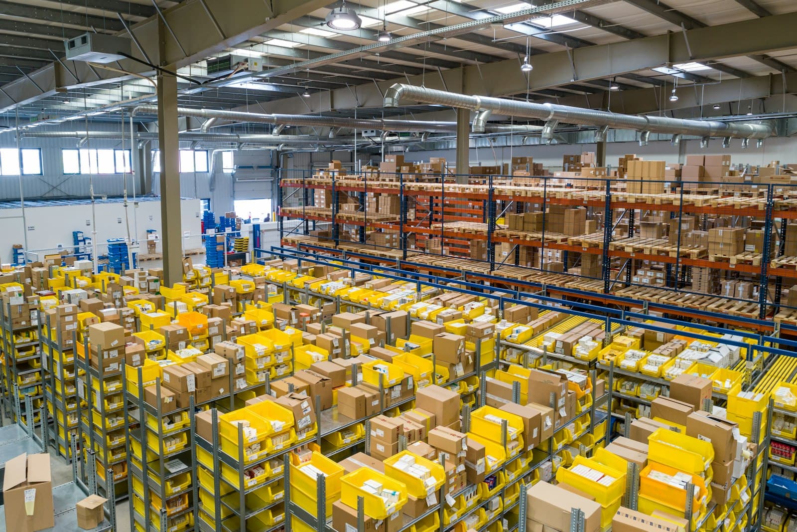 A busy distribution warehouse stacked with palletised goods